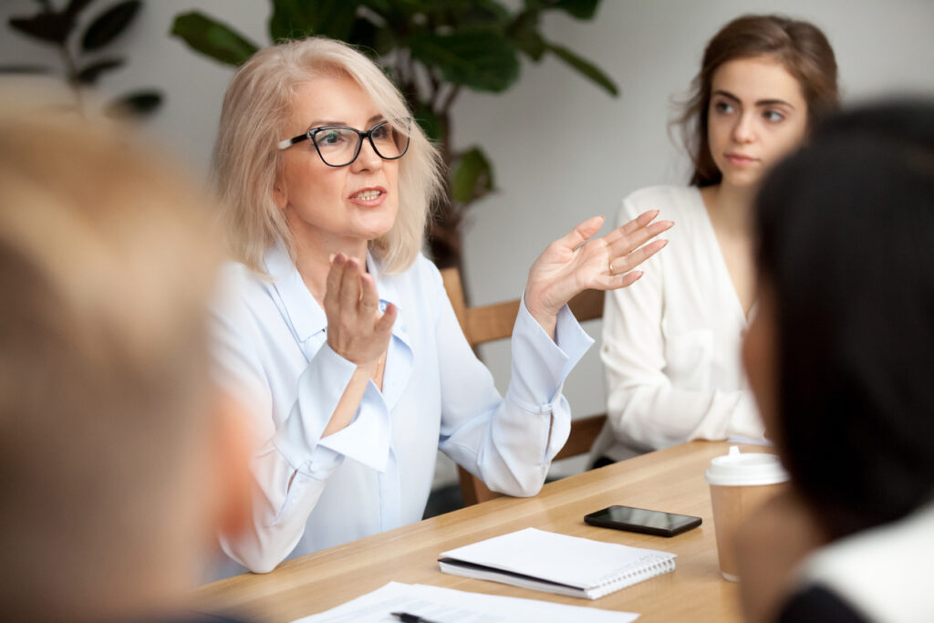 woman manager talking to employees