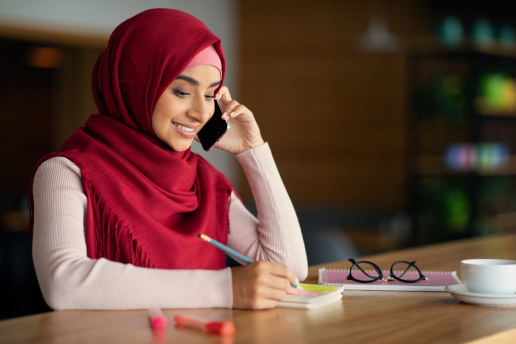 Woman talking on the phone in a phone interview