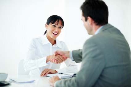 Man interviewing a woman in person